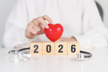 Happy New Year 2026 with Stethoscope of doctor and heart shape on table. health care, Insurance, Wellness and medical conceptsの写真素材
