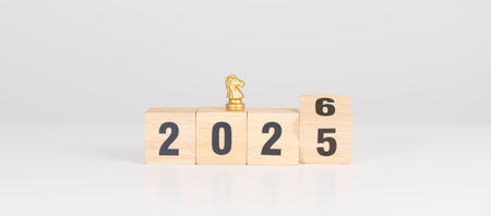 Happy New Year 2025 change to 2026 year block with horse chess. Year of the Horse, animals of the Chinese zodiac, horoscope, success and good fortuneの写真素材