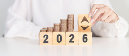 2026 New year with change to UP and Down arrow with coin stack. Interest rate, GDP, stocks market, financial, deflation and Inflation, mortgage, debt, Loan and Economic Recessionの写真素材