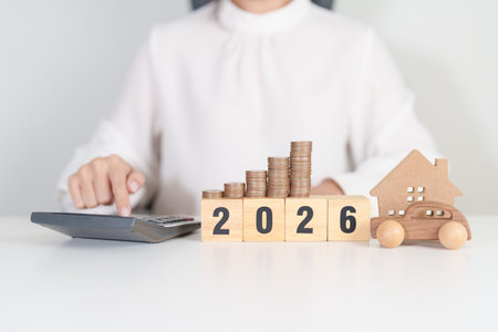 Happy New Year 2026 with car and Home model with coin stack. Car loan, Interest rate, real estate,...