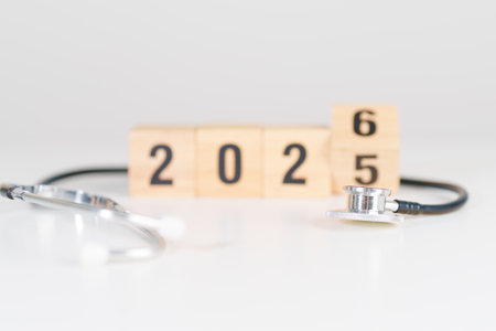 2025 end year to Happy New Year 2026 with Stethoscope of doctor and heart shape on table. health care, Insurance, Wellness and medical conceptsの写真素材