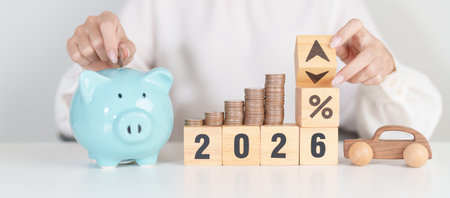 2026 New Year with percentage change to UP and Down arrow, car model and coin stack. Car loan,...