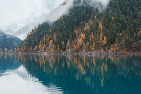 Scenery Jiuzhaigou national park in Sichuan, China. Beautiful Long lake and snow mountain in Autumn...