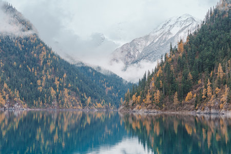 Scenery Jiuzhaigou national park in Sichuan, China. Beautiful Long lake and snow mountain in Autumn season. Famous Landmark and Vacation near Chengdu, China. Asia travel conceptの写真素材