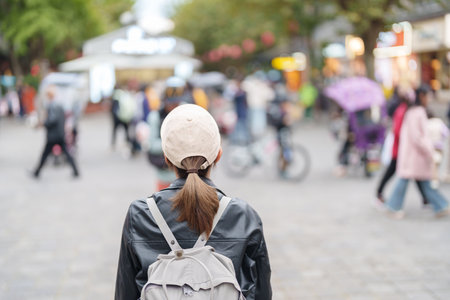 Happy woman traveler travel in Dujiangyan city. Tourist sightseeing Guanxian Ancient City near Chengdu. Landmark and popular for tourism attraction in Sichuan, Chinaの写真素材