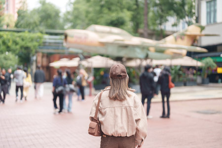 Happy woman traveler travel in Chengdu city. Tourist sightseeing and shopping in Eastern Suburb...