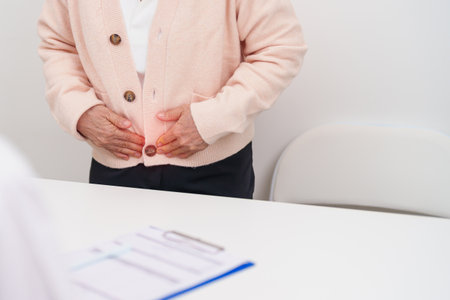 Elderly Woman patient having pain and consulting doctor for Ovarian and Cervical cancer, Cervix disorder, Endometriosis, Hysterectomy, Uterine fibroids, Reproductive system and Pregnancy conceptの写真素材