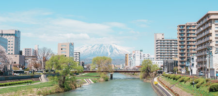 Beautiful Iwate mountain and Kitakami river with flowers blooming in Spring season, cityscape...