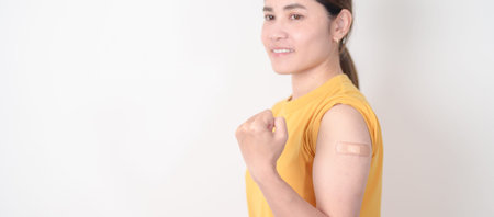Adult Woman with bandage after received vaccine. Vaccination and Immunization for Influenza, HPV,...