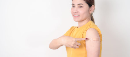 Adult Woman with bandage after received vaccine. Vaccination and Immunization for Influenza, HPV,...