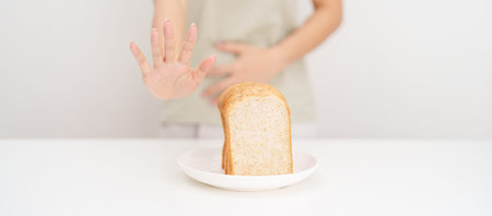 Gluten intolerance, Gluten free and celiac disease or Wheat allergy. woman with wheat bread and...