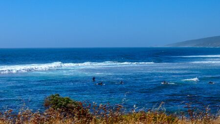Surfers learning how to surf in Margaret River, Western Australia