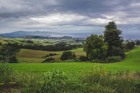 view of green fields and mountains on Sao Miguel, Azores, Portugal