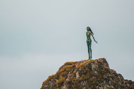 Lady on the Rock at WhakatÄne Heads, North Island, New Zealandの写真素材