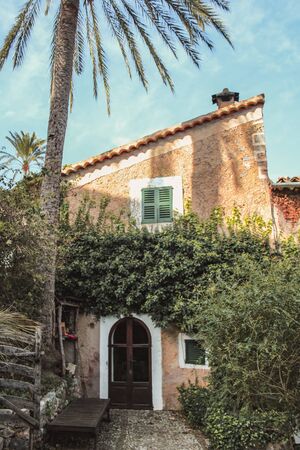 Spanish style house with plants and flowers located in Mallorca, Spainのeditorial素材