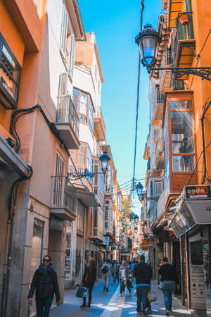Palma, Mallorca / Spain - March 26 2018: Street in the capital Palma de Mallorca. Tourists strolling in the shopping street during a sunny day.のeditorial素材