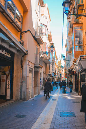 Palma, Mallorca / Spain - March 26 2018: Street in the capital Palma de Mallorca. Tourists strolling in the shopping street during a sunny day.のeditorial素材
