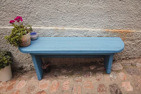 Blue bench in a street in Krk town on the island Krk in Croatiaの写真素材