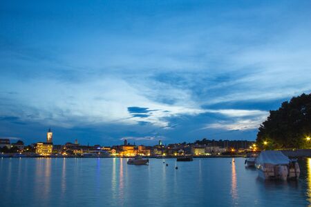 Picturesque coastal view of Rab town waterfront at night. Rab island, Croatiaの写真素材