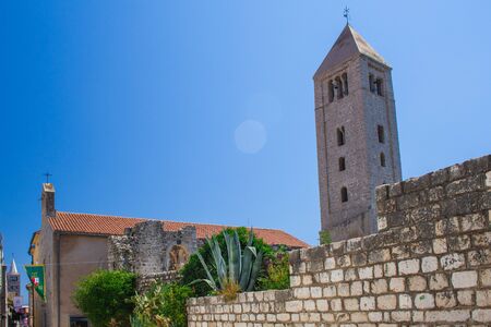 Bell tower of the Benedictine Monastery of St. Andrew in Rab town on Rab island, Croatiaの写真素材