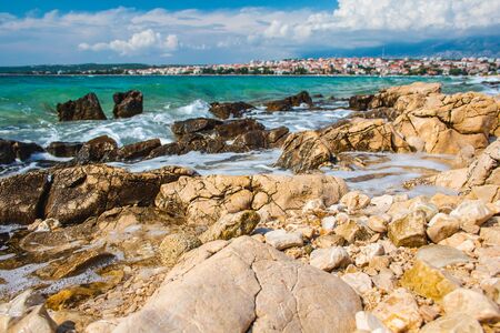 Picturesque coastal view of Novalja town and pebble beach on Pag island in Croatiaの写真素材