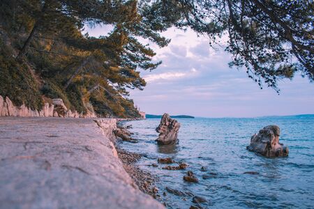 walkway and waterfront at Komrcar city park in Rab town on Rab island, Croatia