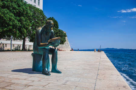 Zadar, Croatia - July 26 2018: Waterfront of Zadar. Sculpture of Spiridon Brusina, a croatian malacologistのeditorial素材