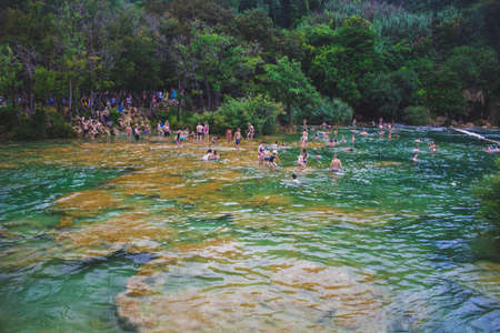 Krka National Park, Croatia - July 27 2018: People enjoying the water at famous tourist attraction in Croatiaのeditorial素材
