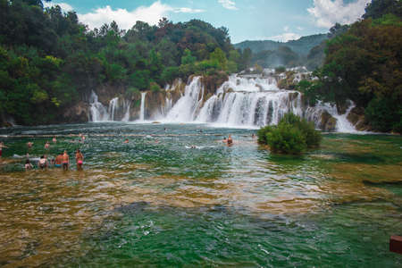 Krka National Park, Croatia - July 27 2018: Wild landscape and waterfall at famous tourist attraction in Croatiaのeditorial素材