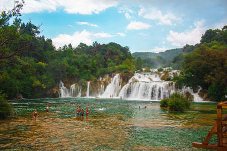 Krka National Park, Croatia - July 27 2018: Wild landscape and waterfall at famous tourist attraction in Croatiaのeditorial素材