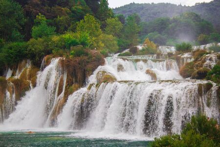 Waterfall and wild landscape at famous tourist attraction in Croatiaの写真素材
