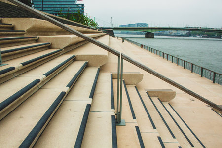 Rheinboulevard in the city center of Cologne, Germany. Empty stairs and no people on walkwayの写真素材