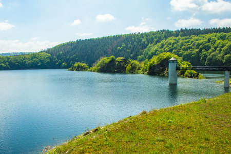 Lake Urft at Eifel National Park, Germany. Scenic view of lake and river Urft and surrounded lush green landscape in North Rhine-Westphaliaの写真素材