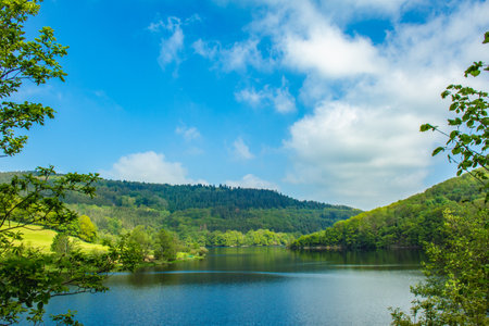 Rursee at Eifel National Park, Germany. Scenic view of lake Rursee and surrounded green hills in North Rhine-Westphaliaの写真素材
