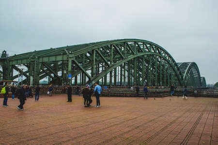 COLOGNE, GERMANY - May 20 2019: People meeting at square next to the famous Hohenzollern Bridge in Cologne, Germanyのeditorial素材
