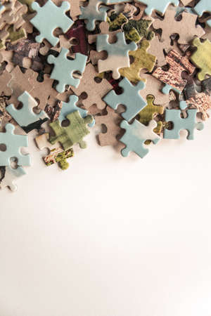 Puzzle. Background with half jigsaw puzzle and half white copy space for your text and designの写真素材