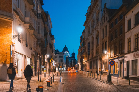 Brussels, BELGIUM - October 8, 2021: Nightlife in Brussels.. People strolling through the streets of Belgiums capitalの写真素材