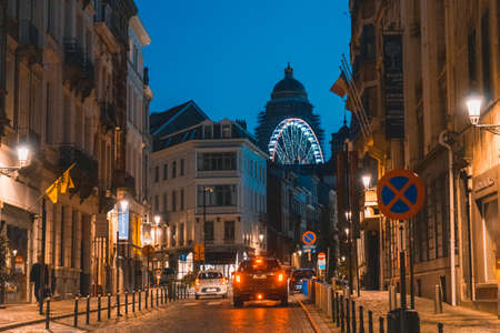 Brussels, BELGIUM - October 8, 2021: Nightlife in Brussels.. People strolling through the streets of Belgiums capitalの写真素材