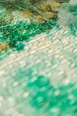 jigsaw puzzle completed, detailed view of green and white partsの写真素材