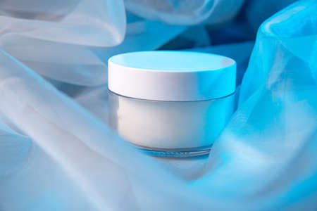 white jars on fabric with lightingの写真素材