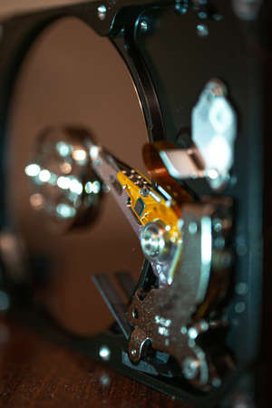 Disassembled open hard disk drive HDD of a computer or laptop close-up. computer technology and equipment. Macroの写真素材