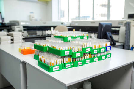 desktop with lab flasks and test tubes.