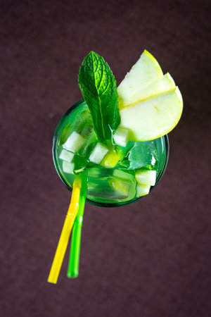 green lemonade with apple and mint in a glass glass.の写真素材