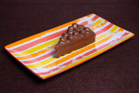 children's chocolate dessert on a bright plate.の写真素材