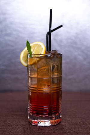 Cold lemonade with lemon and ice in a glass.の写真素材