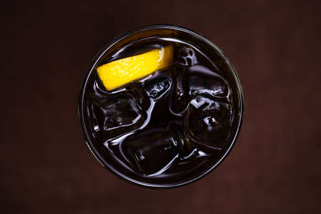 view from above on alcoholic cocktail with ice and citrusの写真素材