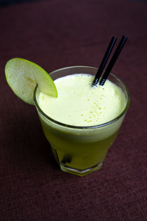 refreshing summer cocktail with green apple in a glass.の写真素材