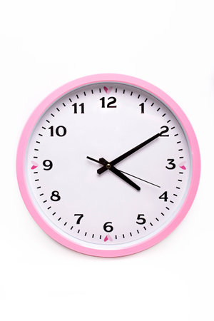 wall pink watch with black dial on white background.