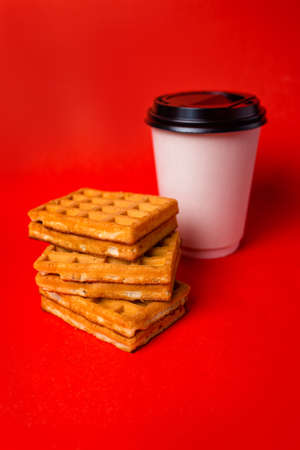 Hungarian waffles with caramel filling and cup of coffee.の写真素材