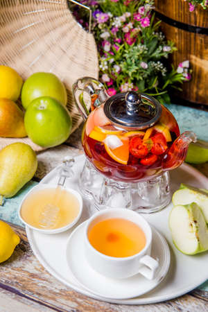 bright summer fruit tea on the table in the restaurant.の写真素材